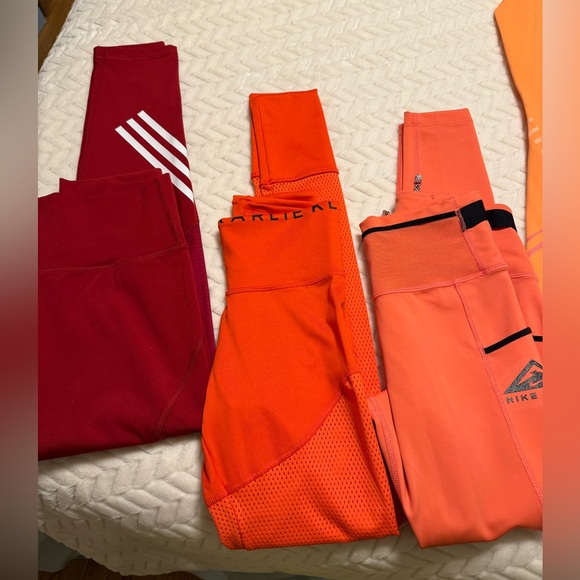Hello, I’m selling my Nike leggings NWT & some NWOT the yellow/red are adidas .. - Picture 2 of 4